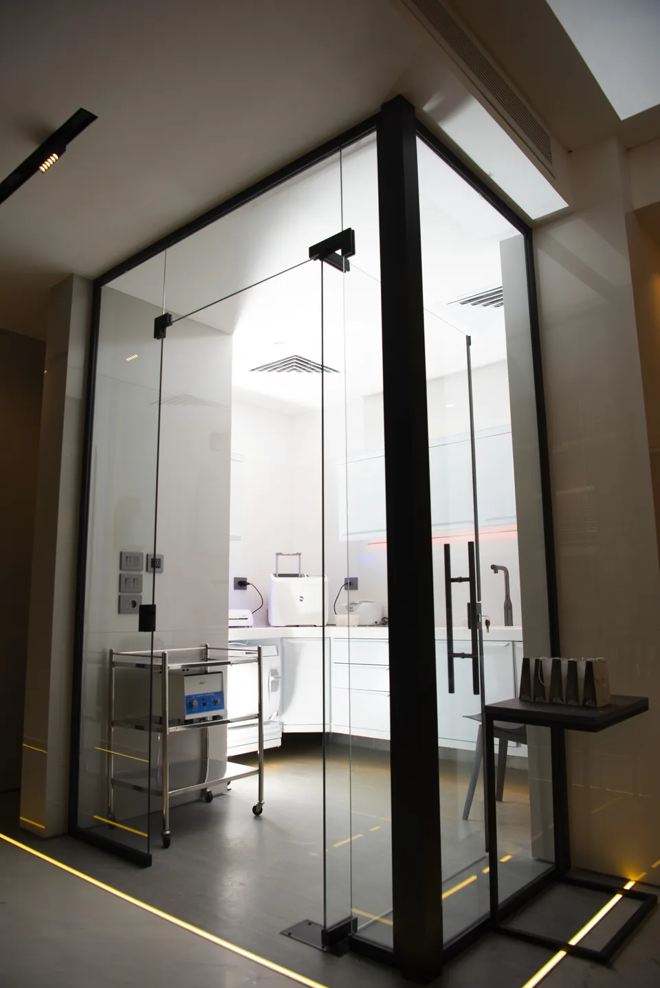 A glass doorway into the clinic's treatment rooms
